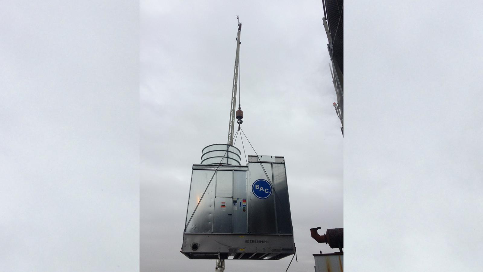 crane delivering equipment to roof of william black building