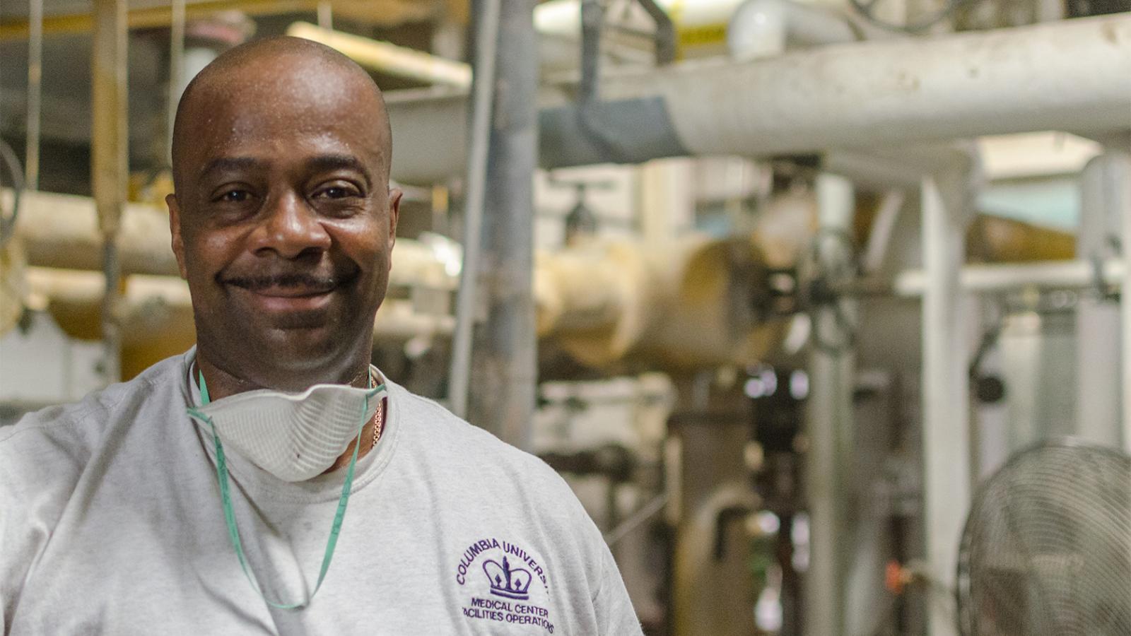 A member of the Facilities Engineering team in an engineering room