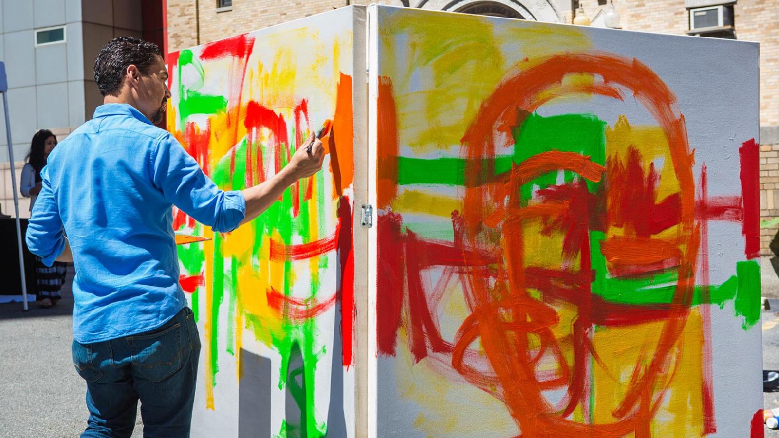 Local artists paints canvas