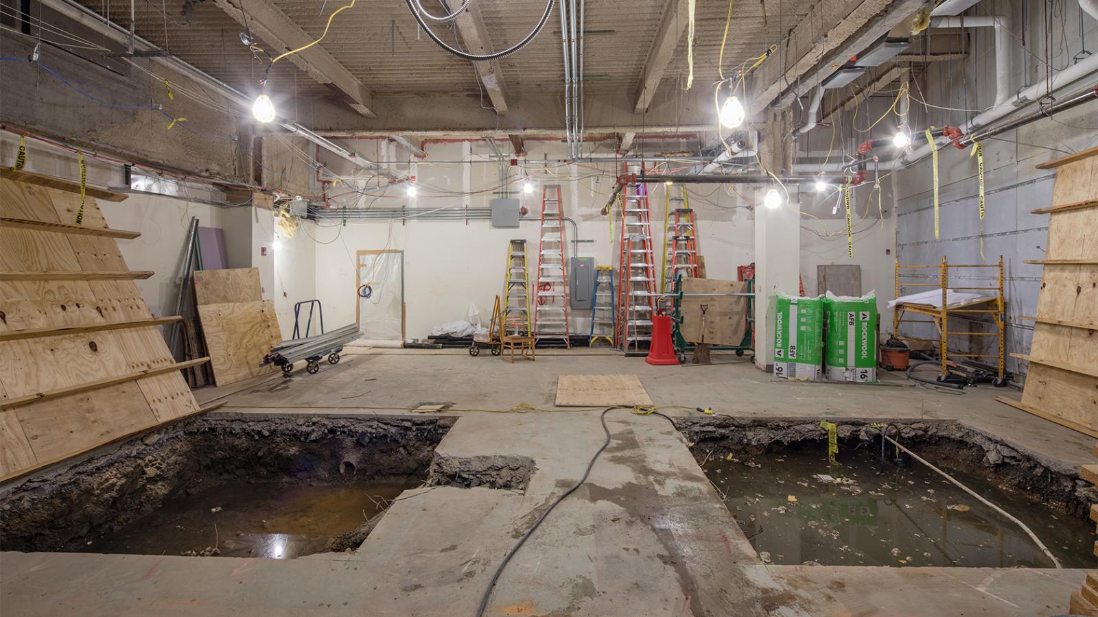 Demolished interior of Hammer LL2 construction site showing two dug pits