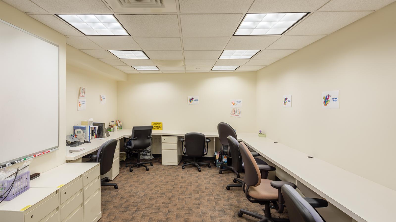 Study room with chairs and a white board