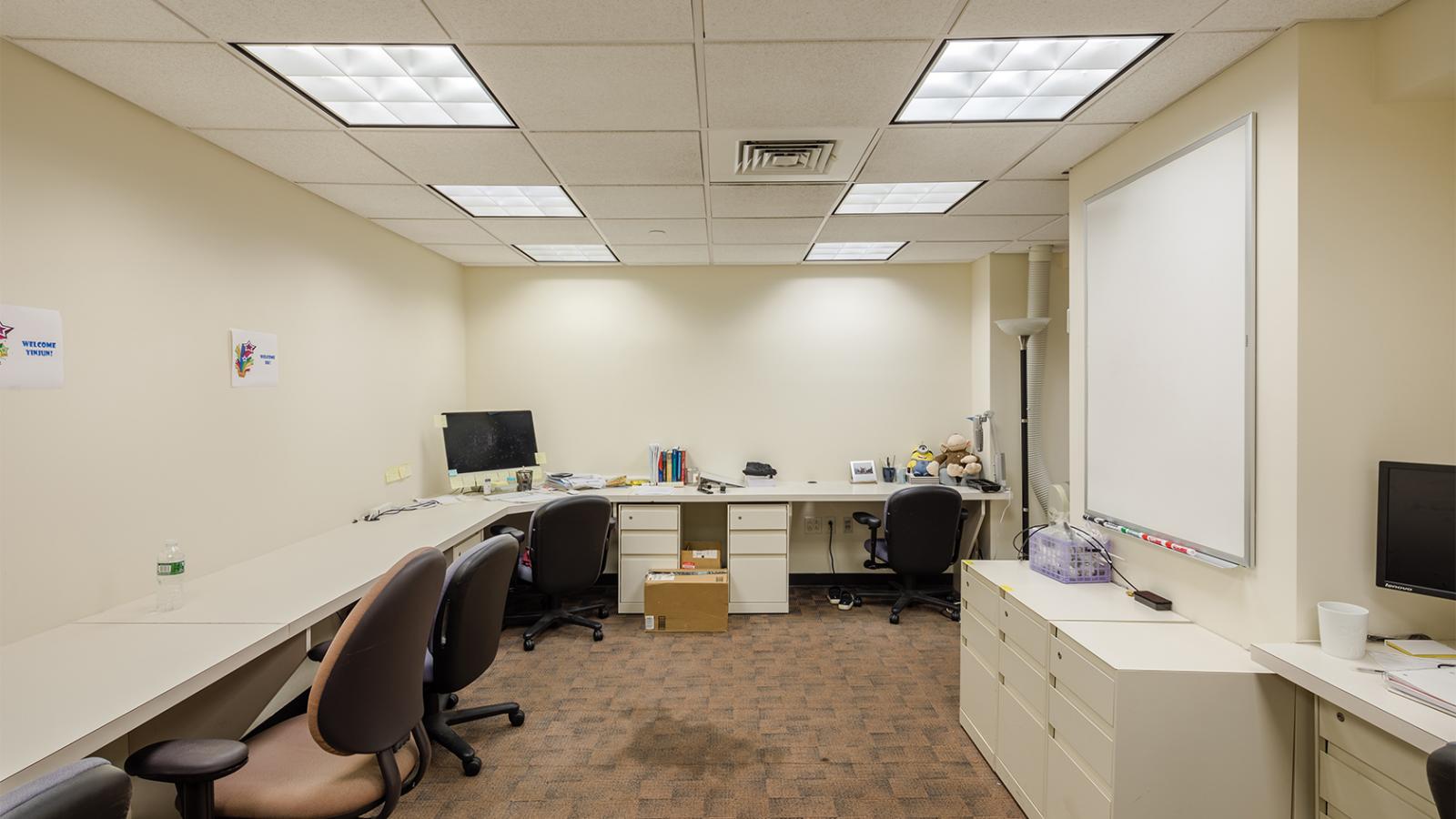 Study room with chairs and a white board
