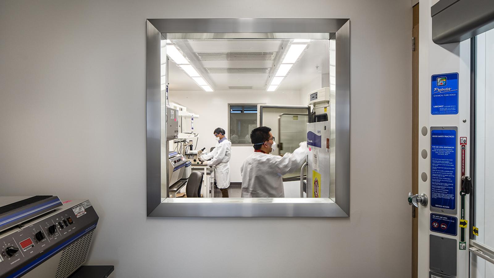 two individuals working in an Aaron Diamond AIDS Research Center laboratory