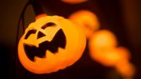 A string of orange lights shaped like jack o'lanterns