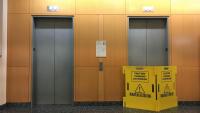 An elevator lobby in Hammer Health Sciences Center, with one elevator blocked off for work