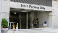 The entrance to the staff-only parking garage at the Irving Cancer Research Center