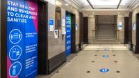VP&S lobby with COVID-19 elevator signage and floor decals