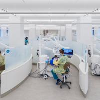 Operatories with dental clinic students and patients