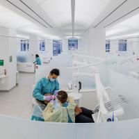 Operatory with dental clinic students and patient