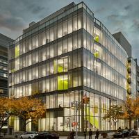 The exterior of a campus building at night.