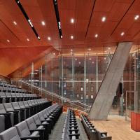 An updated, brightly-lit, auditorium.