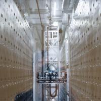 Automated robotic storage system with high-density shelving inside the BRIDGE Biobank facility.
